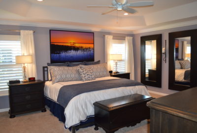Bedroom framed with Furniture and Mirrors