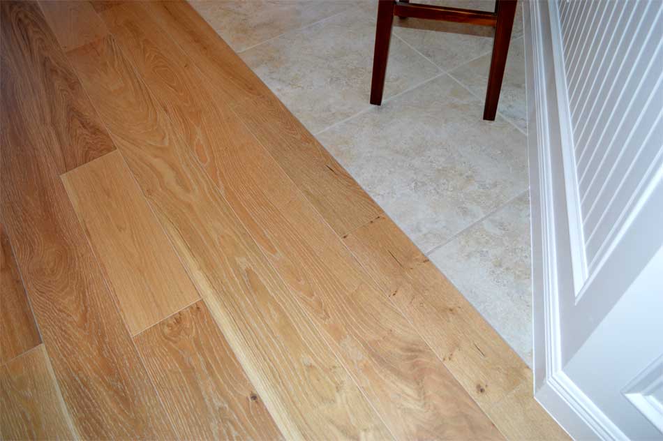 Seamless transition from Hardwood to Tile.