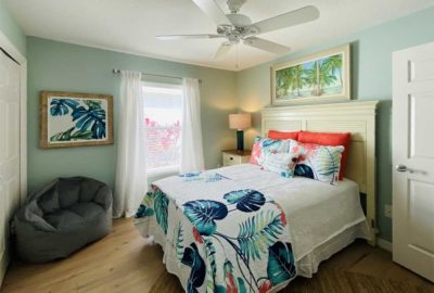 This model is a Bonifay and the guest room was specifically designed for the Florida fun, function, and color!