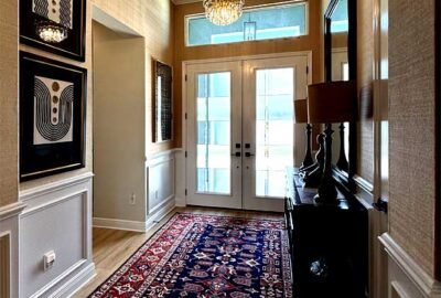 Foyer with wall paper and stacked art, Home Décor by Ruth Dyer - in the Villages of Florida.
