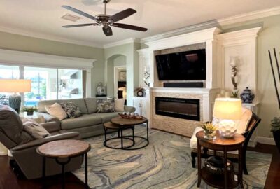 The large fireplace creates an impressive focal point, Home Décor by Ruth Dyer - in the Villages of Florida.