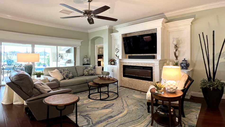 The large fireplace creates an impressive focal point, Home Décor by Ruth Dyer - in the Villages of Florida.