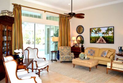 Recovered wing back chairs, curated furniture and an area rug, Home Décor by Ruth Dyer - in the Villages of Florida.