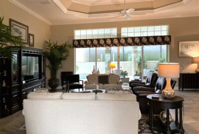 Before was dark, fireplace in a St. Charles model, Interior Design - in the Villages of Florida.