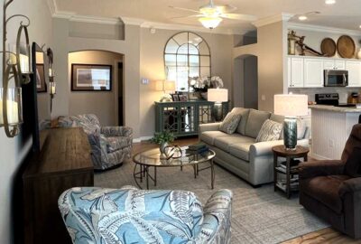 This shot that shows the mirror and furniture, Living room of a Monticello courtyard villa, Finishing Touch - by Ruth Dyer.