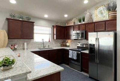 gray backdrop lets her décor and cabinets shine, Kitchen of Siesta Model, Interior Design - in the Villages of Florida.