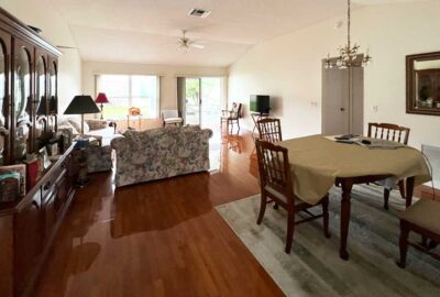 The Straight Road, Before, pictures are dark and the loveseat divides the space. dark and the loveseat divides the space, language of architecture, living room and dining room, Jasmine model, Interior Design - by Ruth Dyer.