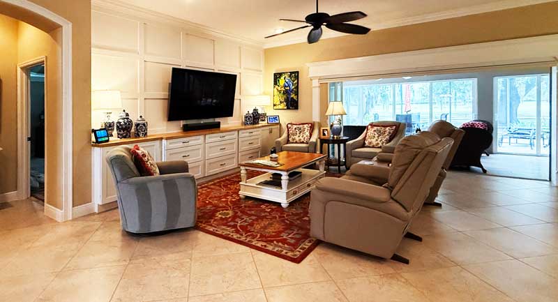 After - Warmth of the Red but the color looks Harmonious. Warmth of the Red but looks Harmonious, living room of a Lantana model, Interior Design - by Ruth Dyer.